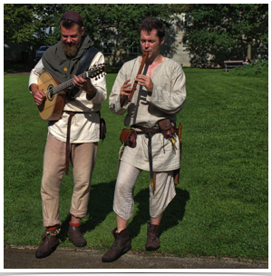 Two actors in Viking dress serenading us with Viking tunes.